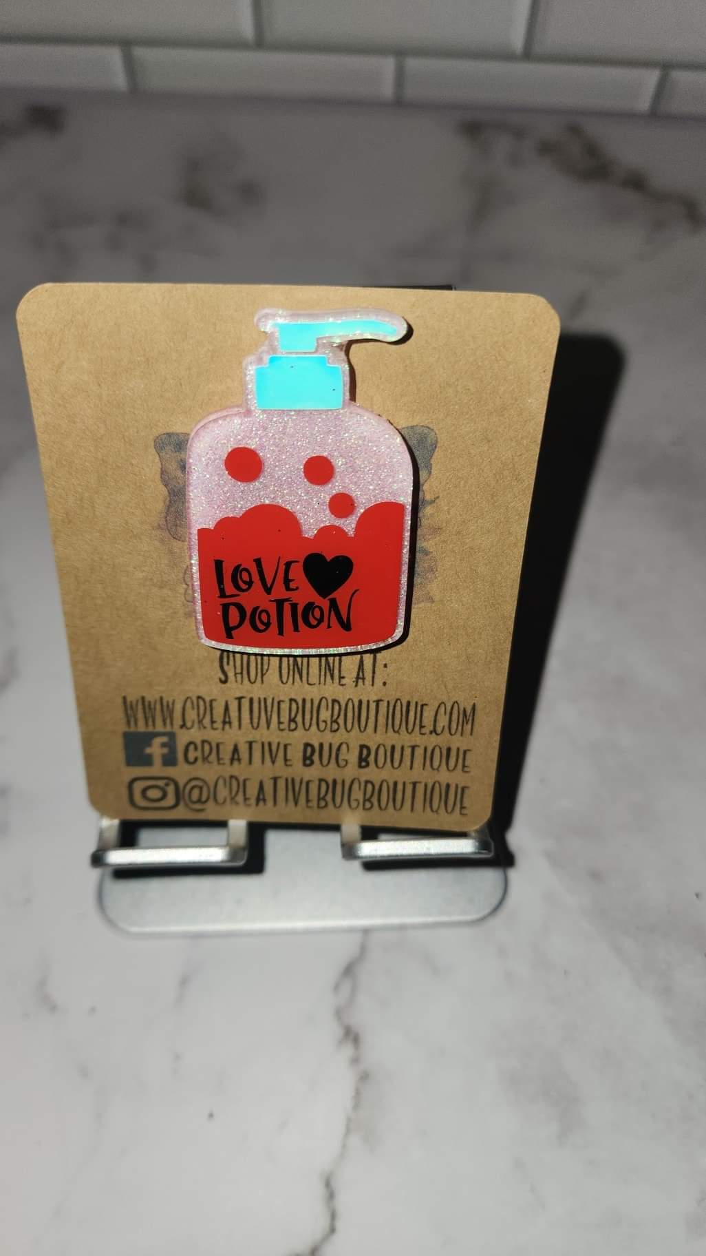 Love Potion Bottle Badge Reel